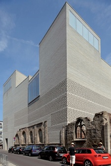 The modern walls of Kolumba Museum are built onto medieval masonry and window openings