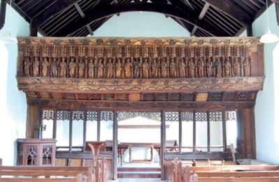 The richly carved rood screen viewed from the nave
