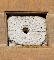 Mass dial comprising concentric circles and radial lines with later addition of bevelled sandstone frame