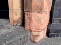Column base with localised failure of terracotta in which glazed surface has been eroded away