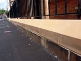 Slip-cast terracotta wall plinth bearing railings