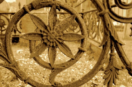 Railing detail comprising spiral structure and central flower motif