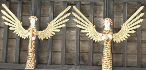 Ornate red and gold angels at the church of St Kyneburgha, Castor, Lincolnshire