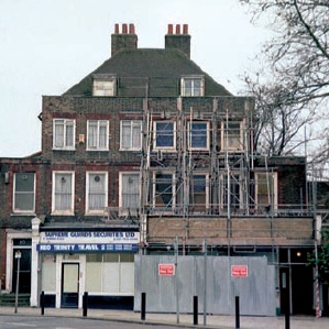 The partially scaffolded front facade in 2004