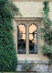 Uniform colour scheme to window frame, drip moulding and wall