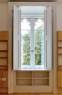 Room interior showing folding window shutters