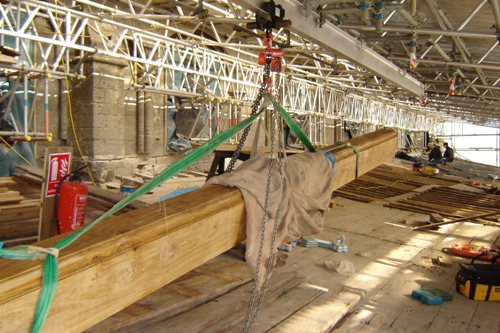 Big beam suspended from hoist