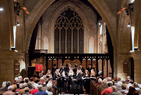 A choir performs in a church nave