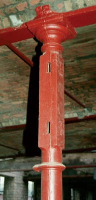 Red painted cast iron column with visible casting seam