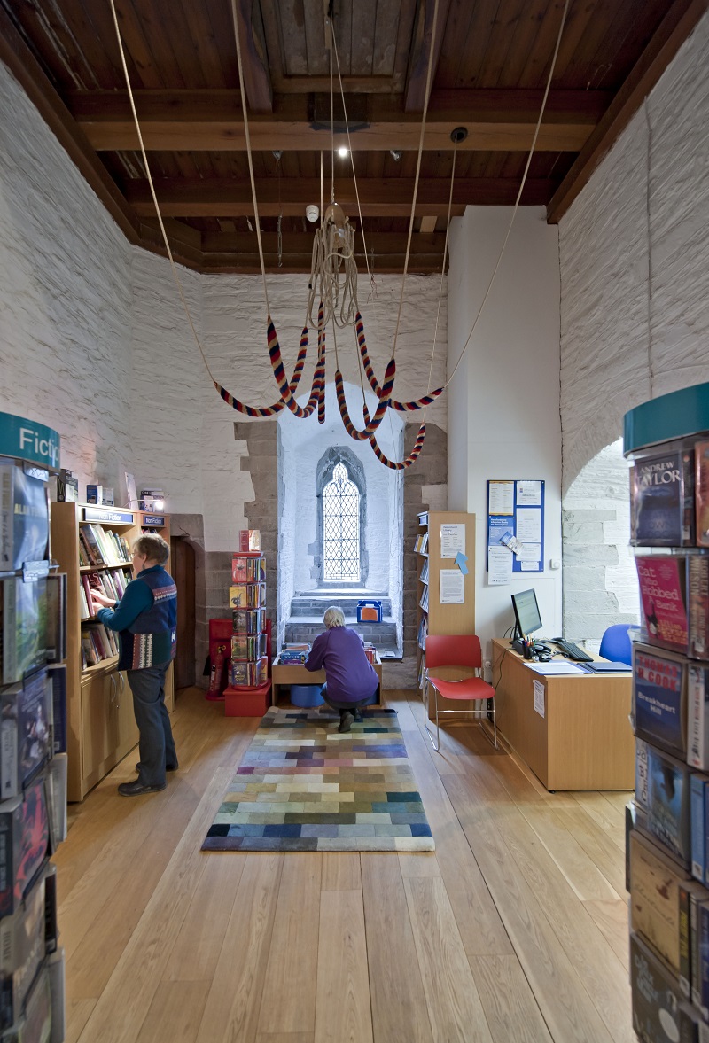 A library in the bell tower of St Peter's, Peterchurch, Herefordshire