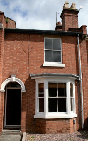 Facade of terraced house with sash windows