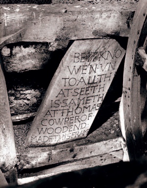 B/w photo showing a 17th-century inscription on a bell frame attributing the work to 'Thomas Cowper of Woodend'