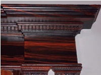 Red-brown graining on a darker ground applied to fine joinery