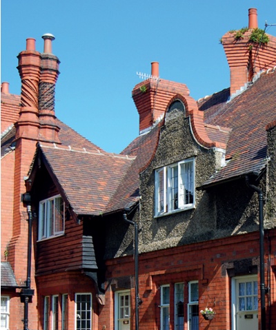 Elaborately detailed terraced houses with mixed red brick and pebbledash facade