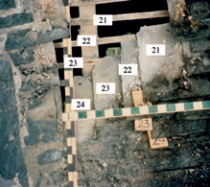 Photo of roof exterior showing exposed laths and with slipped slates and their original positions numbered